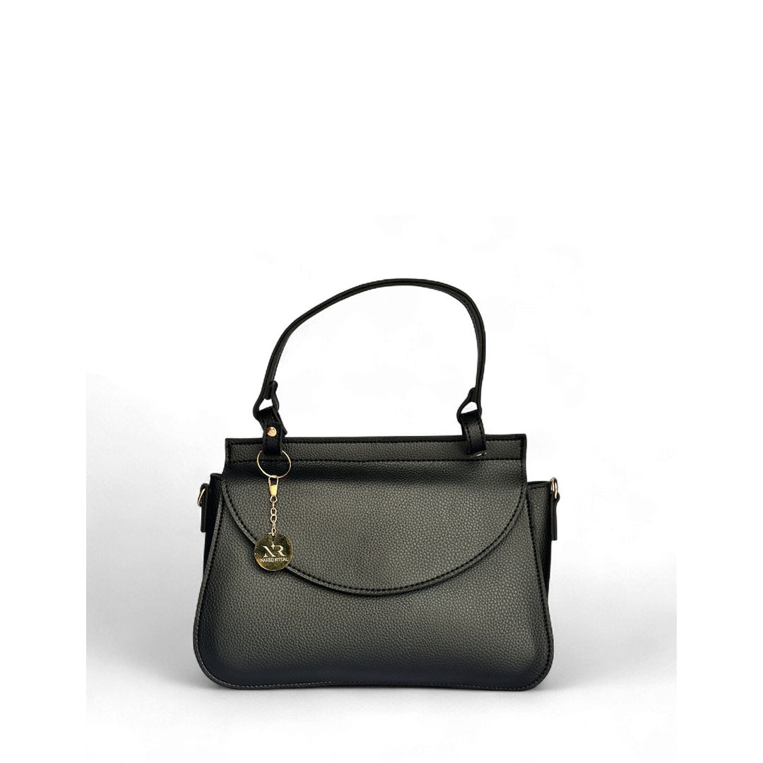 Elegant black pebble-grain faux leather handbag with curved flap closure and gold-tone logo charm.